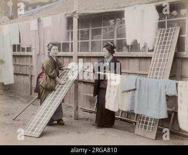 Women doing laundry in Japan. Vintage 19th century photograph. Stock Photo