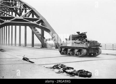 Vintage photograph World War II - British tank crosses bridge Waal river Stock Photo
