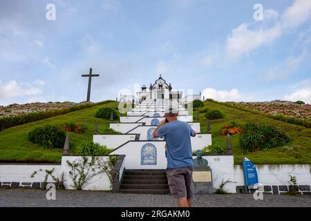 Vila Franca do Campo, Azores, 19.09.2019 - Tourist take picture of the  church of Nossa Senhora da Paz in Vila Franca do Campo in Sao Miguel island in Stock Photo