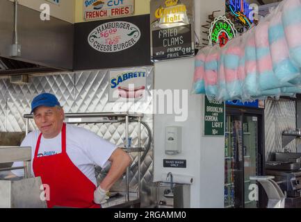 Deli owner in Coney Island poses for a photo in the summer. Stock Photo