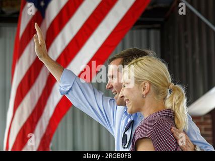 Kentucky Gov. Andy Beshear waves to the crowd with his wife, first lady Britainy Beshear, by his side at the 143rd St. Jerome Fancy Farm Picnic on Saturday, Aug. 5, 2023 in Fancy Farm, Graves County, KY, USA. Incumbent Democrat Beshear is seeking a second term as governor of the Commonwealth of Kentucky against Republican nominee Daniel Cameron. (Apex MediaWire Photo by Billy Suratt) Stock Photo