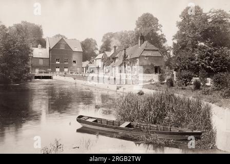 Vintage 19th century photograph: Whitchurch Mill and cottages. Whitchurch is a market town in northern Shropshire, England. It lies 2 miles east of the Welsh border, 2 miles south of the Cheshire border. Stock Photo