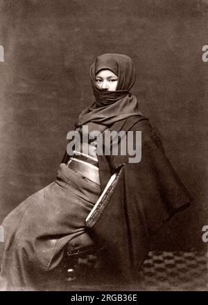 Japanese woman in winter clothing, Japan, c.1870's Stock Photo