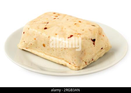 Block of halloumi cheese with red chilli on white ceramic plate isolated on white. Stock Photo
