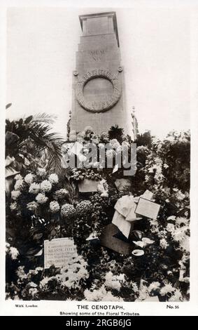 The Cenotaph, Whitehall, London - some of the floral tributes lain beneath the monument on Remembrance Day. Designed by Edwin Lutyens, the memorial was built from Portland stone between 1919 and 1920 by Holland, Hannen & Cubitts Stock Photo