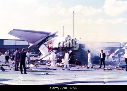 Hawker Siddeley Trident 1C G-ARPT (msn 2121), of British European Airways, at London Heathrow Airport, after the crash of BKS Air Transport Airspeed Ambassador G-AMAD on 3 July 1968. Airspeed Ambassador, G-AMAD, was flying a cargo of 8 horses from Deauville to London. When approaching the runway 28R threshold at London Airport, the left wing suddenly dropped. The wing-tip, followed by the left main gear wheels touched the grass to the left of the runway. The crew tried to increase power to go around, but the aircraft flew on with an increasing bank angle. The plane struck two parked BEA HS-121 Stock Photo