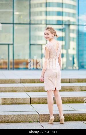 Beautiful young business woman in modern glass office interior Stock Photo