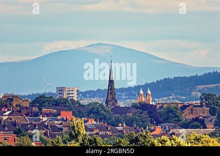 Glasgow, Scotland, UK. 8th  August, 2023. UK Weather: Sunny in the city saw the distant tinto hill the highest spot in central scotland towers over the west end  cottiers theatre spire from over  30 miles away .  Credit Gerard Ferry/Alamy Live News Stock Photo