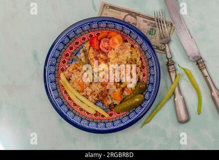 Old historic knife nad fork with color plate with turkey meat fresh risotto Stock Photo