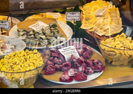 Milan, Italy - 30 March 2022: Handmade pastas displayed on the shop window of an Italian pasta store in Milan, Italy. Stock Photo