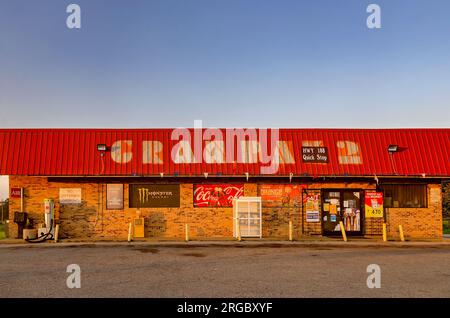 The sun sets on Gran-Pak 2 gas station and convenience store, Aug. 4, 2023, in Grand Bay, Alabama. Stock Photo