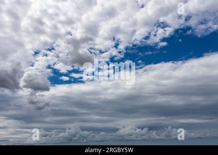 Blue sky with clouds background overlay. Ideal for sky replacement, screen saver or any other application Stock Photo