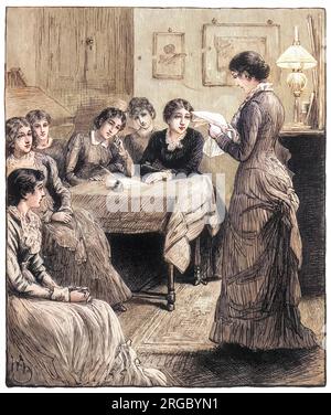 A group of female students discuss a piece of school work. Stock Photo