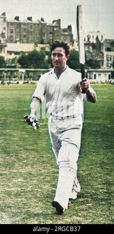 Cricketer Denis Compton acknowledges the crowd at the Central Recreation Ground, Hastings. Playing for 'The South' against 'Sir Pelham Warner's Eleven', Middlesex and England star batsman Compton brought his aggregate run total for the season to 3,570, thus beating the long standing record of Tom Hayward, set in 1906. This was a fantastic summer for Compton, just a few days previously he had beaten Jack Hobbs record (set in 1925) of sixteen centuries in a season. Stock Photo