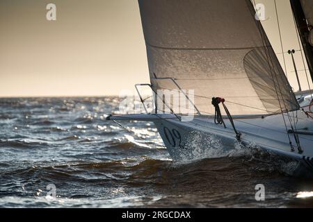 The view through the spray of how the sailboat is heeling at sunset ...