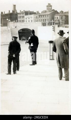 Liverpool, Merseyside - The Queensway (Birkenhead) Mersey Tunnel - Policeman standing by the roadside close to St. John's Gardens Entrance to the tunnel. Stock Photo