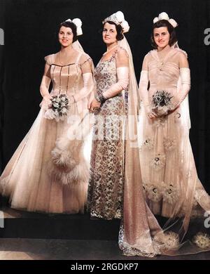 Mrs Joseph Kennedy, wife of H.E. the United States Ambassador, in a photograph to mark the presentation of two of her daughters at the first court at Buckingham Palace in May 1938.  On the left is Rosemary Kennedy (1918 - 2005), in the middle Rose Kennedy and on the right, Kathleen 'Kick' Kennedy.  Kathleen met Billy Cavendish, heir to the Devonshire dukedom during the Season and married him becoming Marchioness of Hartington.  He was killed during World War II and Kathleen herself was killed in a plane crash in 1948.  Rosemary, or Rosie, was deemed mentally retarded and was subjected to a fro Stock Photo