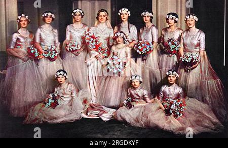 Group wedding photograph showing the bride, Mrs Bryan Guinness, formerly Miss Diana Freeman Mitford, with eleven bridesmaids.  From left, Miss Diana Churchill, Miss Mercer-Nairne, the Hon. Nancy Mitford, the Bride, the Hon. Unity Mitford, Miss Rosemary Mitford (cousin), Miss Rosalie Willoughby and Miss Oonagh Guinness; and , in front, Lady Jean Ogilvy, Miss Grania Guinness, Lady Patricia Guinness and Lady Brigid Guinness.  According to The Sketch, the child attendants wore long-skired frocks of cream tulle with gold tissue bodices and the grown-up bridesmaids had parchment coloured skirts. Stock Photo