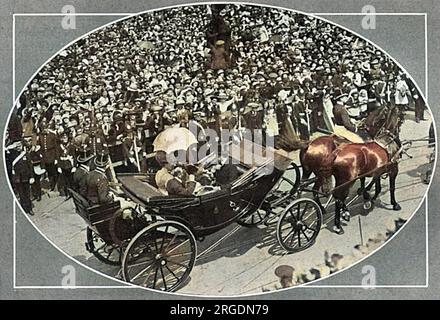 King George V and Queen Mary ride in a carriage on their way to Hull Docks where the King would perform the opening ceremony of the new joint dock. Stock Photo