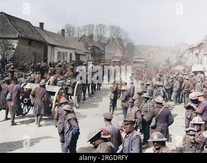 Artillery passing through the village street at Henencourt. A concentration of 17th Division as Vth Corps reserve at the Battle of Rosieres on the Western Front in France during World War I in March 1918 Stock Photo
