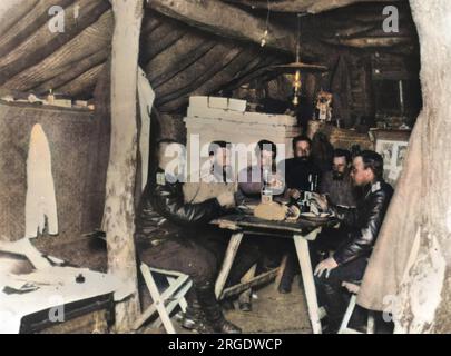 A group of six Russian officers relax in their dugout during the second and final year of the Russo-Japanese War. Stock Photo