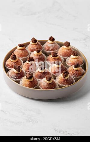Tiramisu donut, espresso, mascarpone & Kahlua mousse filling, salted coffee crumb Stock Photo