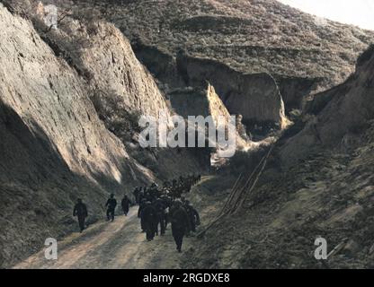 Chinese Communists pictured in rocky terrain during the Long March, a series of marches taking them from the south of China to the north and west, escaping the Kuomintang (Chinese Nationalist Party). Stock Photo