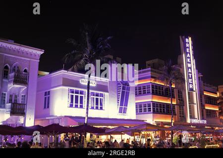 Miami, Florida USA - April 16, 2021: Miami south beach ocean drive illuminated architecture in night miami city at breakwater. Stock Photo