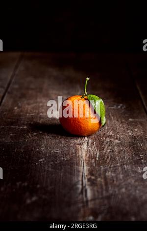 Clementines on a wooden table Stock Photo