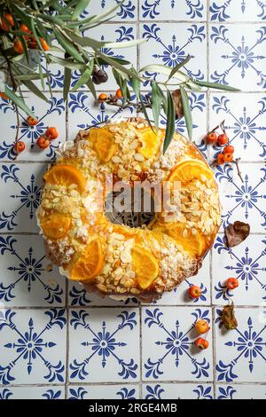 traditional Christmas cake roscon de reyes with figurines of the Three Kings with cream, chocolate and turron, Spanish and Mexican tradition Stock Photo
