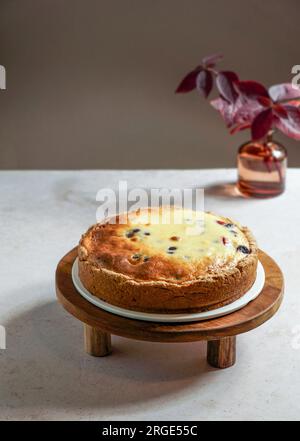 plum cake in asian style minimalism, soft light, white linen tablecloth Stock Photo