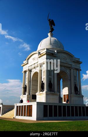 Visitors climb the steps of the Pennsylvania Monument on the grounds of the Gettysburg National Battlefield Stock Photo