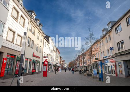 Picture of the main street of Troisdorf, Kolner strasse, with shops and stores while people are passing by. Troisdorf is a city in the Rhein-Sieg-Krei Stock Photo