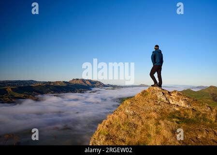 Hiker on top of Te Mata Peak, New Zealand Stock Photo