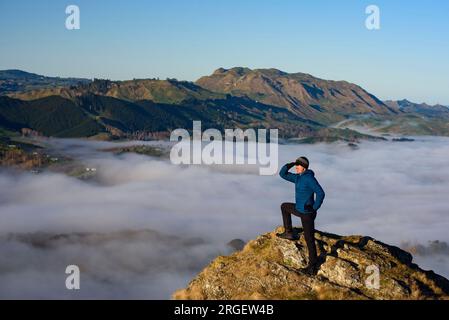 Hiker on top of Te Mata Peak, New Zealand Stock Photo