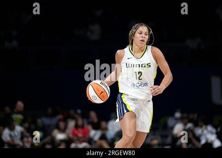 Dallas Wings guard Veronica Burton (12) dribbles during the first half of a  WNBA basketball basketball game against the Phoenix Mercury in Arlington,  Texas, Friday, June 9, 2023. (AP Photo/LM Otero Stock