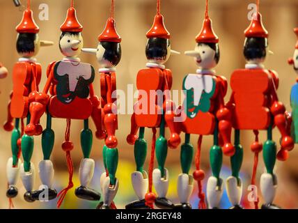 Cracow, Poland - December 19, 2021:Traditional wooden Pinocchio toy sold in souvenir shop in Cracow. Stock Photo