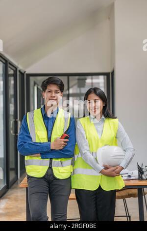 Portrait two engineer asian smileing building contractors standing at office Stock Photo