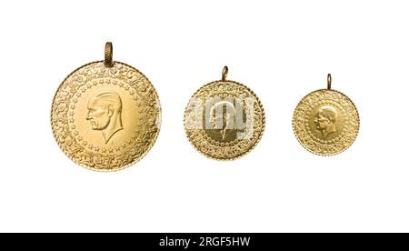 full, half and quarter Turkish gold coins side by side on a white background Stock Photo