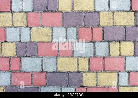 Surface of multi-colored paving slabs. Beautiful pattern, background close-up Stock Photo