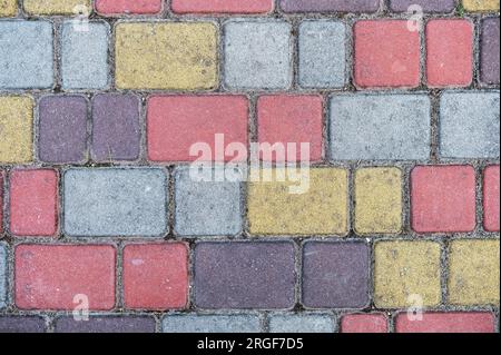Surface of multi-colored paving slabs. Beautiful pattern, background close-up Stock Photo