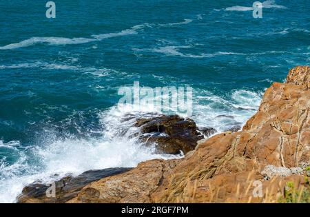 waves crashing on rocks, tuscany italy Stock Photo