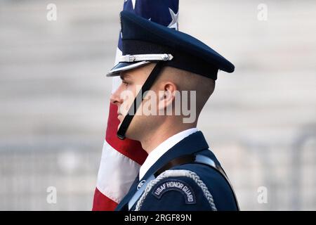 Washington, United States. 08th Aug, 2023. An Air Force Honor Guard passes by the Capitol during a concert event held on the National Mall during sunset, on August 8, 2023 in Washington DC. A major storm expected to hit the region appeared to have missed the Capital region.(Photo by Aaron Schwartz/Sipa USA) Credit: Sipa USA/Alamy Live News Stock Photo