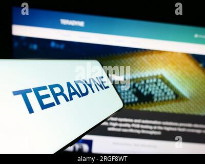 Mobile phone with logo of American test equipment company Teradyne Inc. on screen in front of business website. Focus on center of phone display. Stock Photo