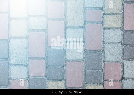 Surface of multi-colored paving slabs. Beautiful pattern, background close-up Stock Photo
