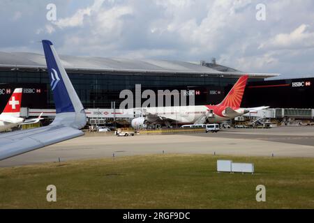 Aeroplanes on Tarmac outside Terminal Two Heathrow Airport London England Stock Photo