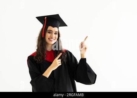 Young Black Female Graduate Smiles In Graduation Attire Background