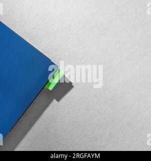 Part of blue notebook on gray background. Flat lay. Place for text Stock Photo