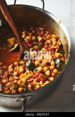 Chickpeas Tagine. savory Moroccan stew with tender chickpeas simmered in aromatic spices, tomatoes and onions. often garnished with herbs and served Stock Photo