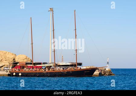 Santorini, Greece - August 15, 2018 : View of a beautiful large tourist boat preparing to sail off at the port of Santorini Greece Stock Photo